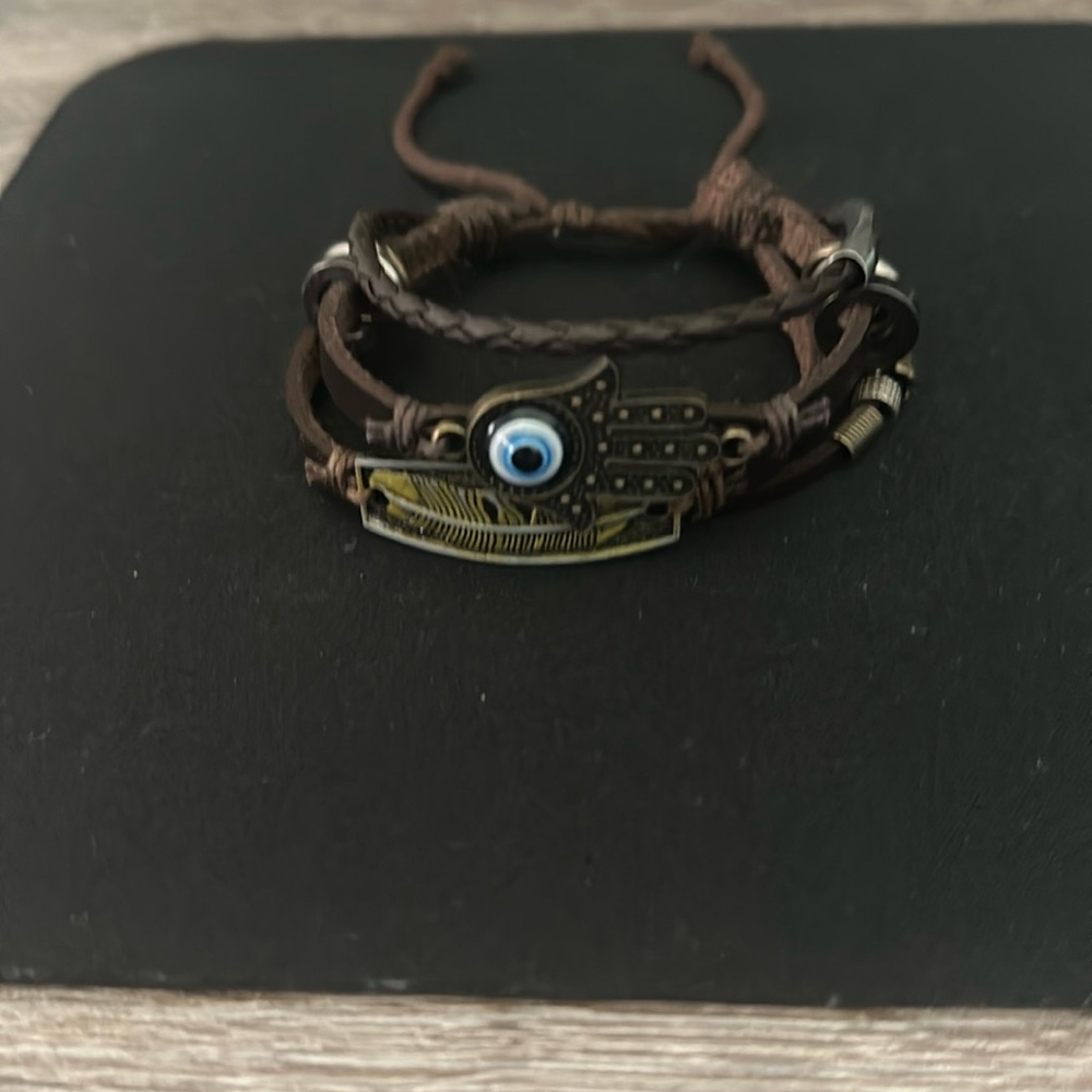Women’s bracelet colored brown with symbol of the eye, silver, and gold accent